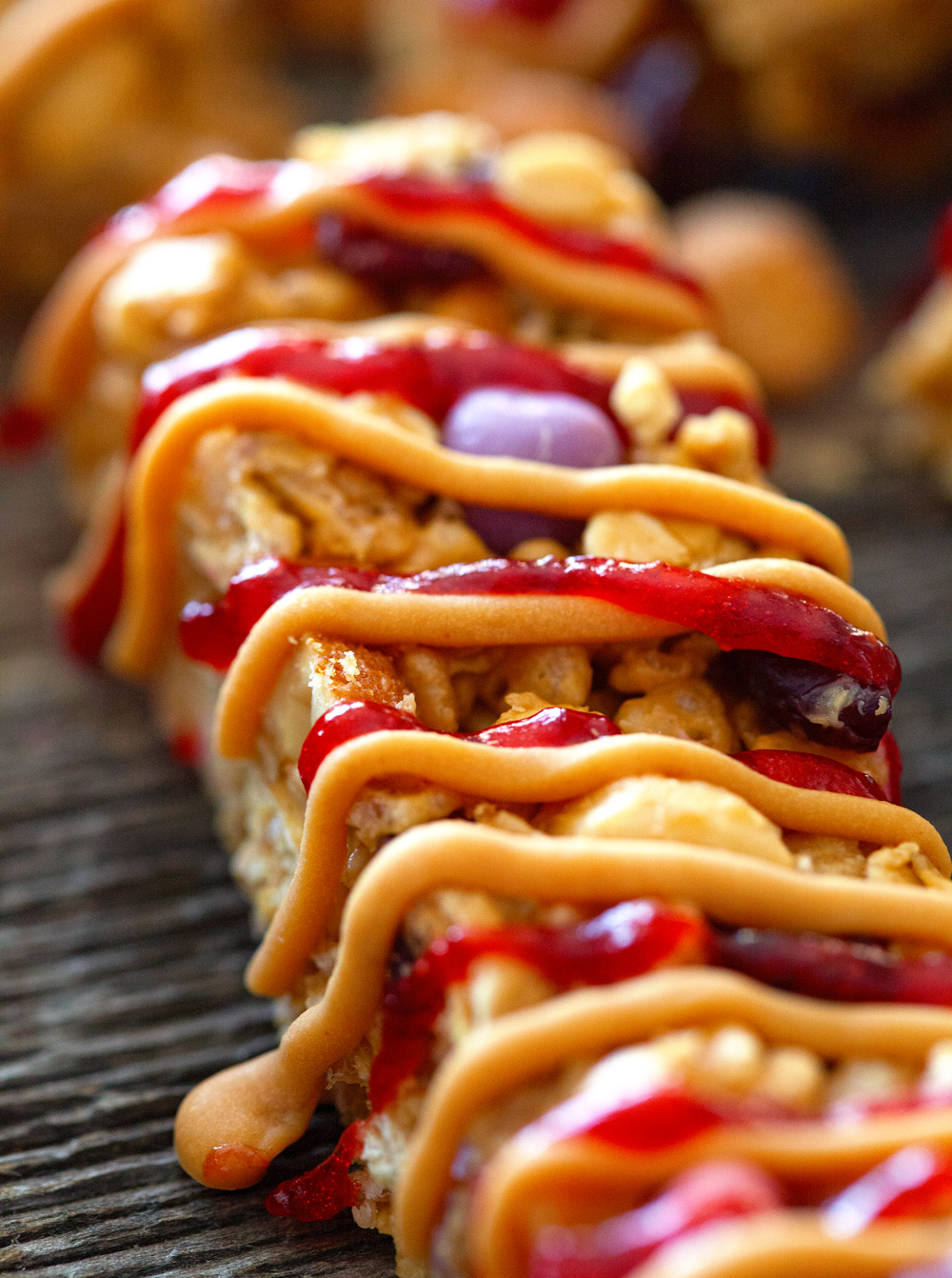 Peanut Butter and Jelly Granola Bars via Deliciously Yum!
