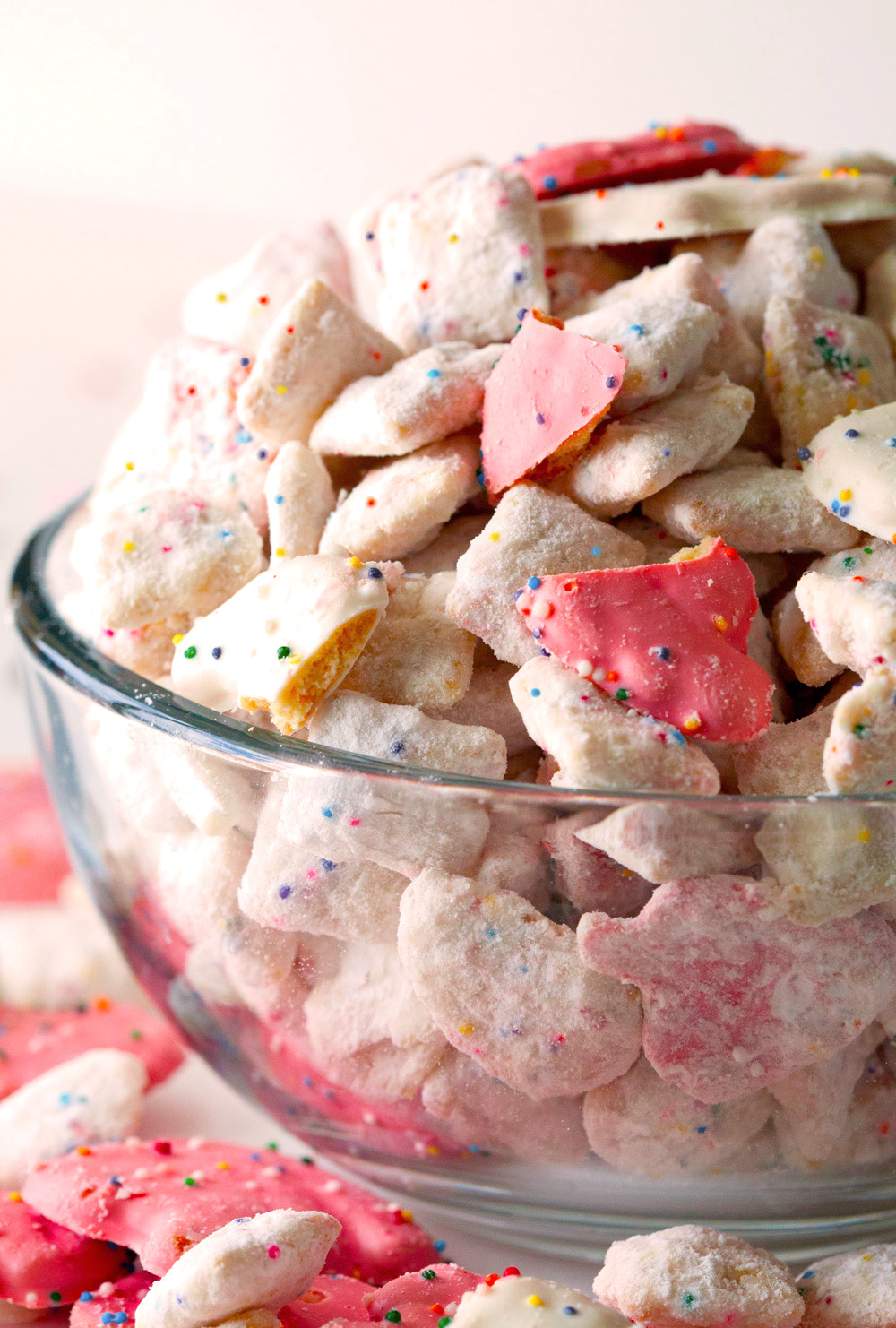 Frosted Animal Cracker Confetti Cake Muddy Buddies by Deliciously Yum!