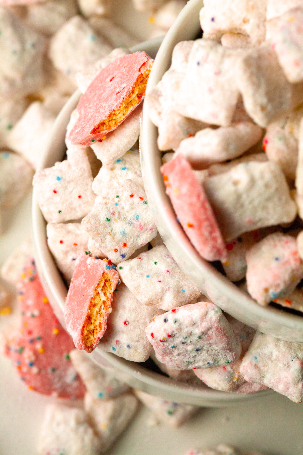 Frosted Animal Cracker Confetti Cake Muddy Buddies by Deliciously Yum!
